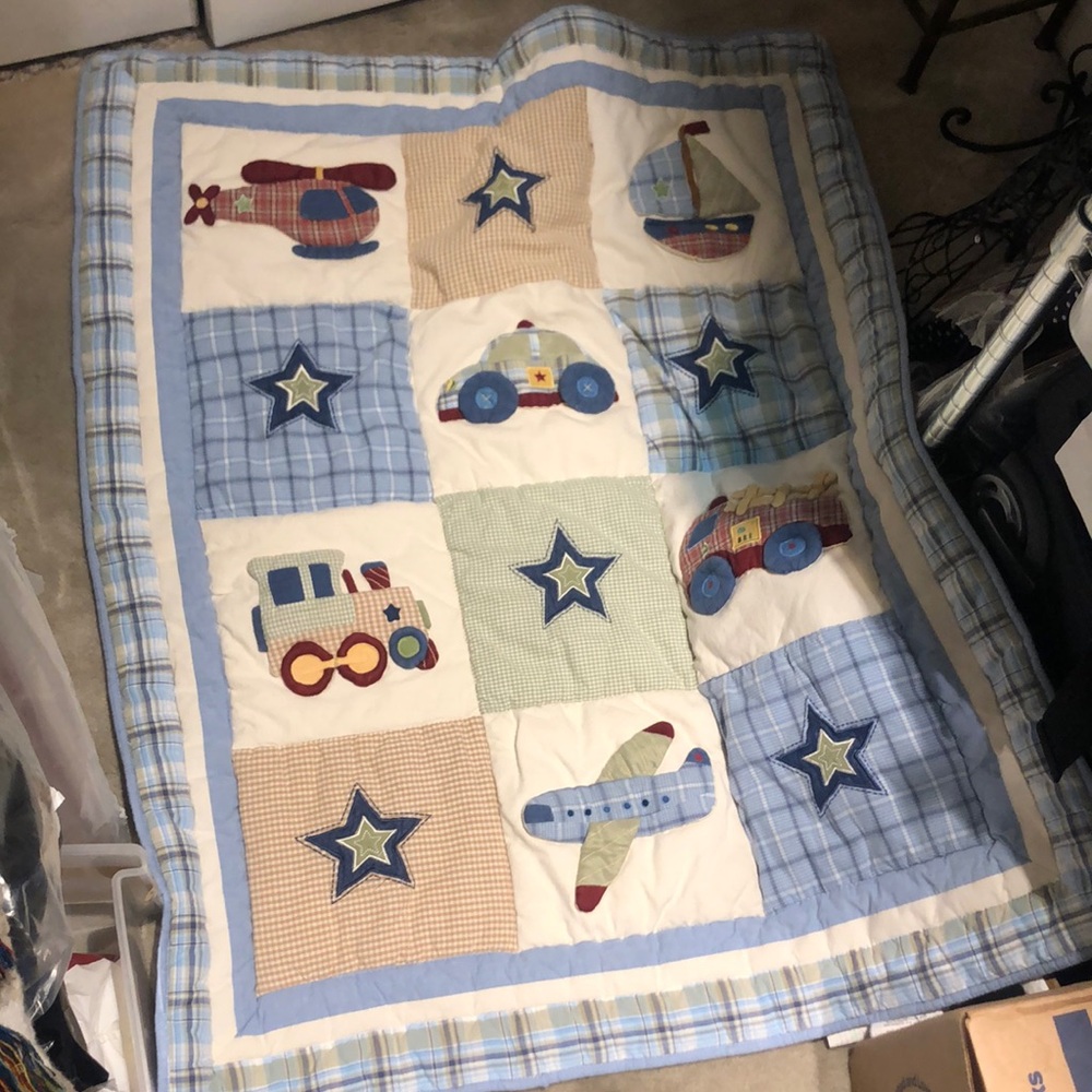 baby quilt w sailboat, helicopters, police, cars, trains, fire, trucks stars